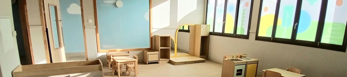 Vue d'ensemble de la salle d'éveil au sein de la crèche Babilou Annecy Leroux